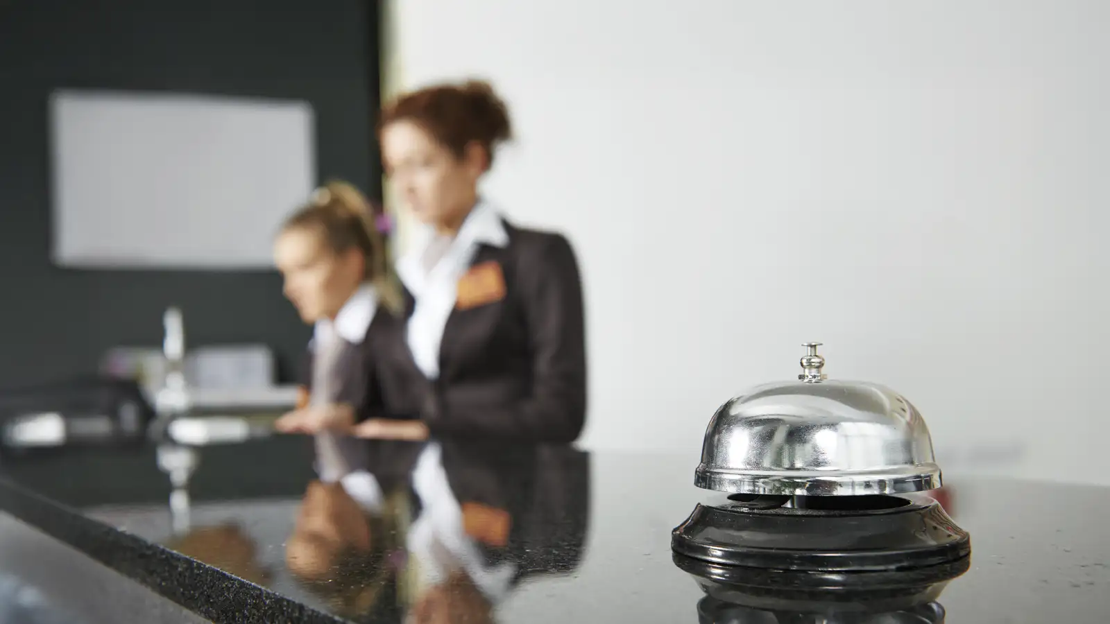 Hotel reception staff representing employers managing payroll and stapled super fund obligations